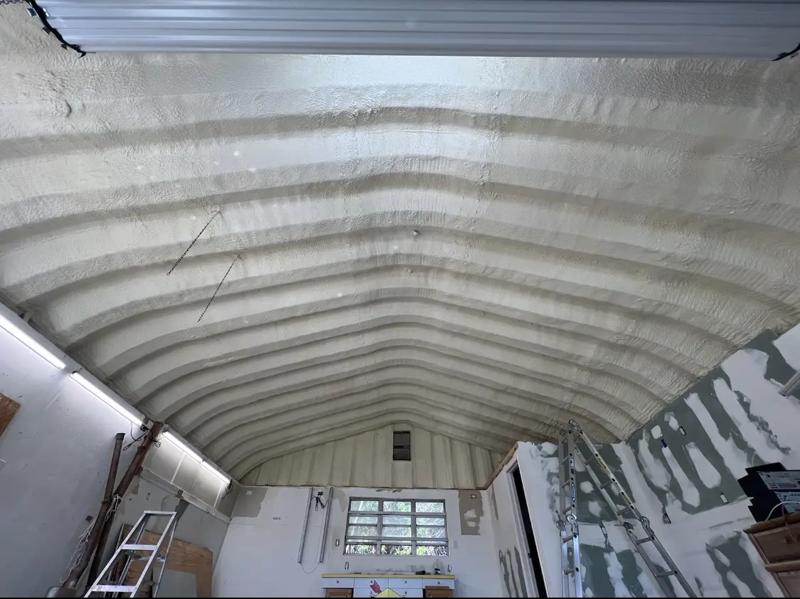 Spray polyurethane foam applied to the underside of a metal roof deck in Escanaba